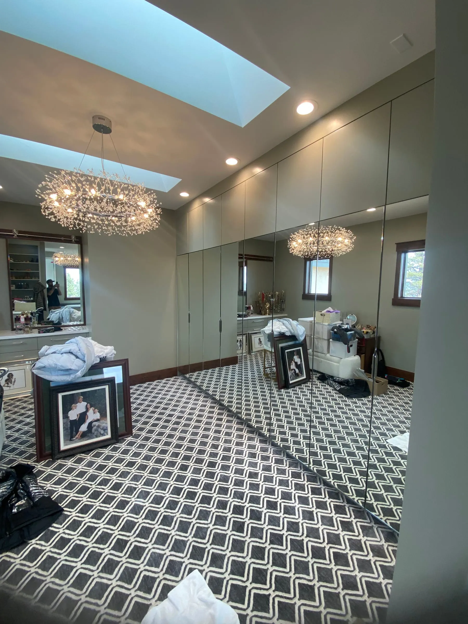 Floor-to-ceiling mirror wall in a dressing room