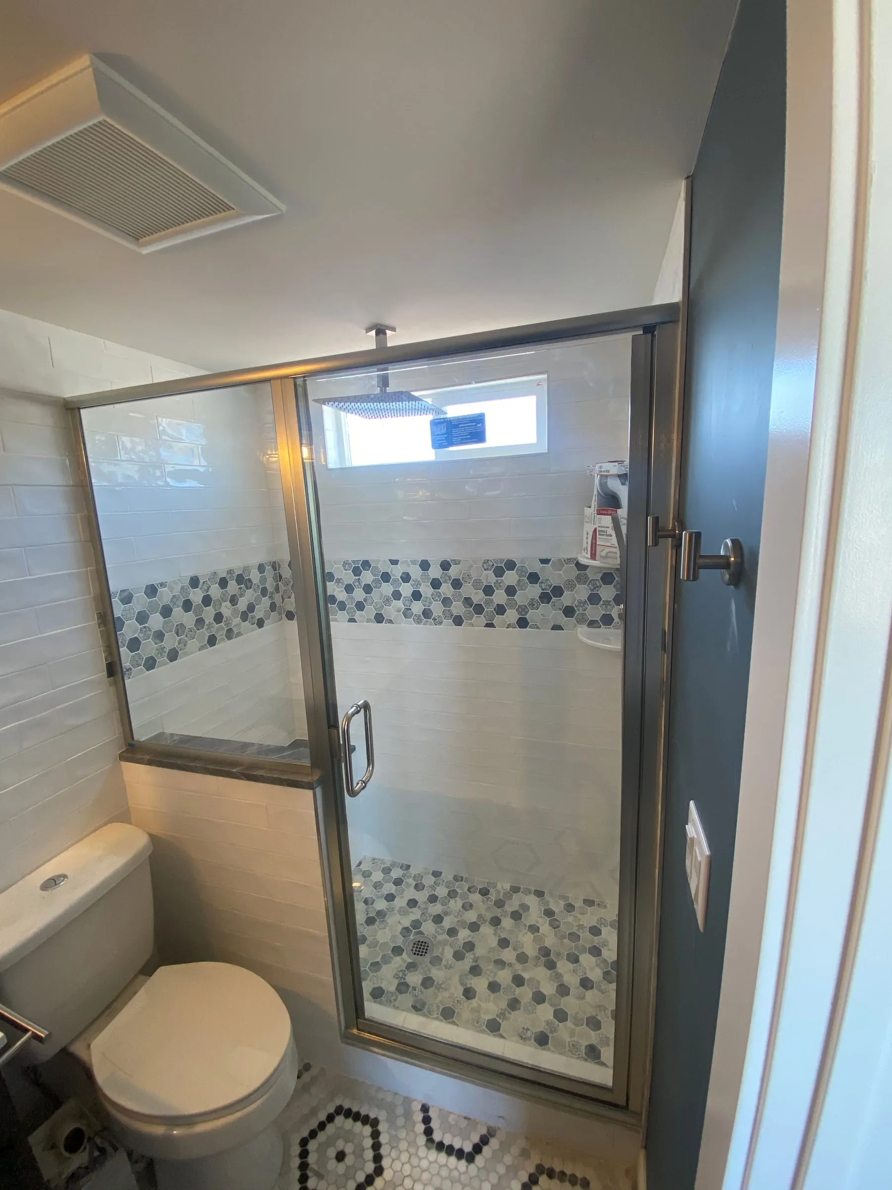Framed shower door with brushed nickel finish