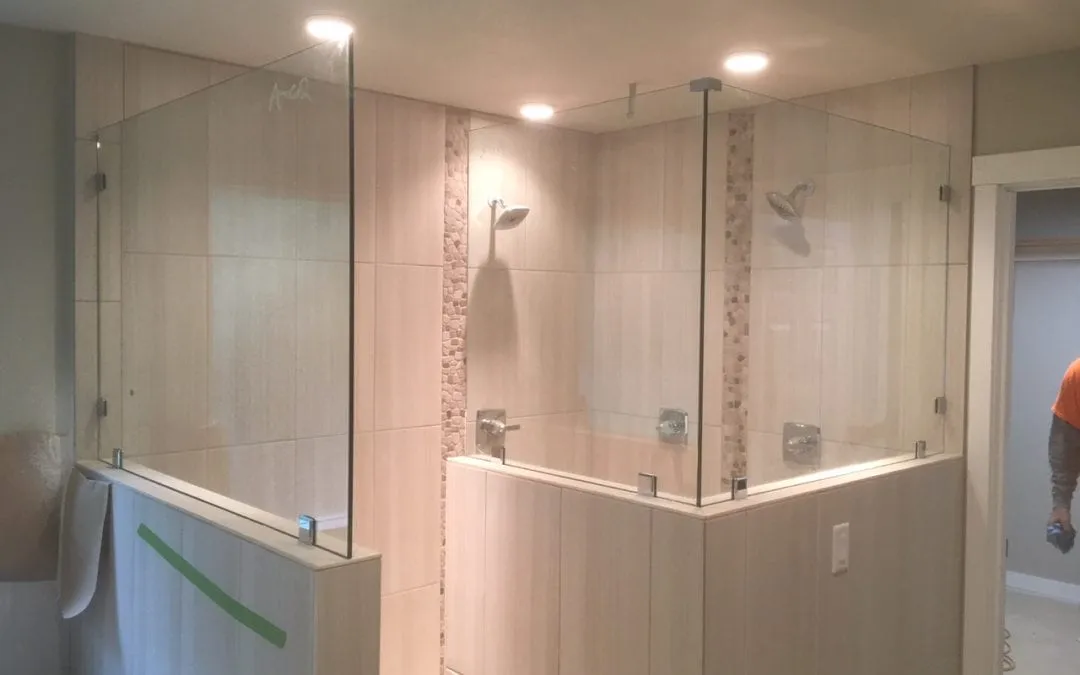 Frameless shower glass installation by Legacy Glass