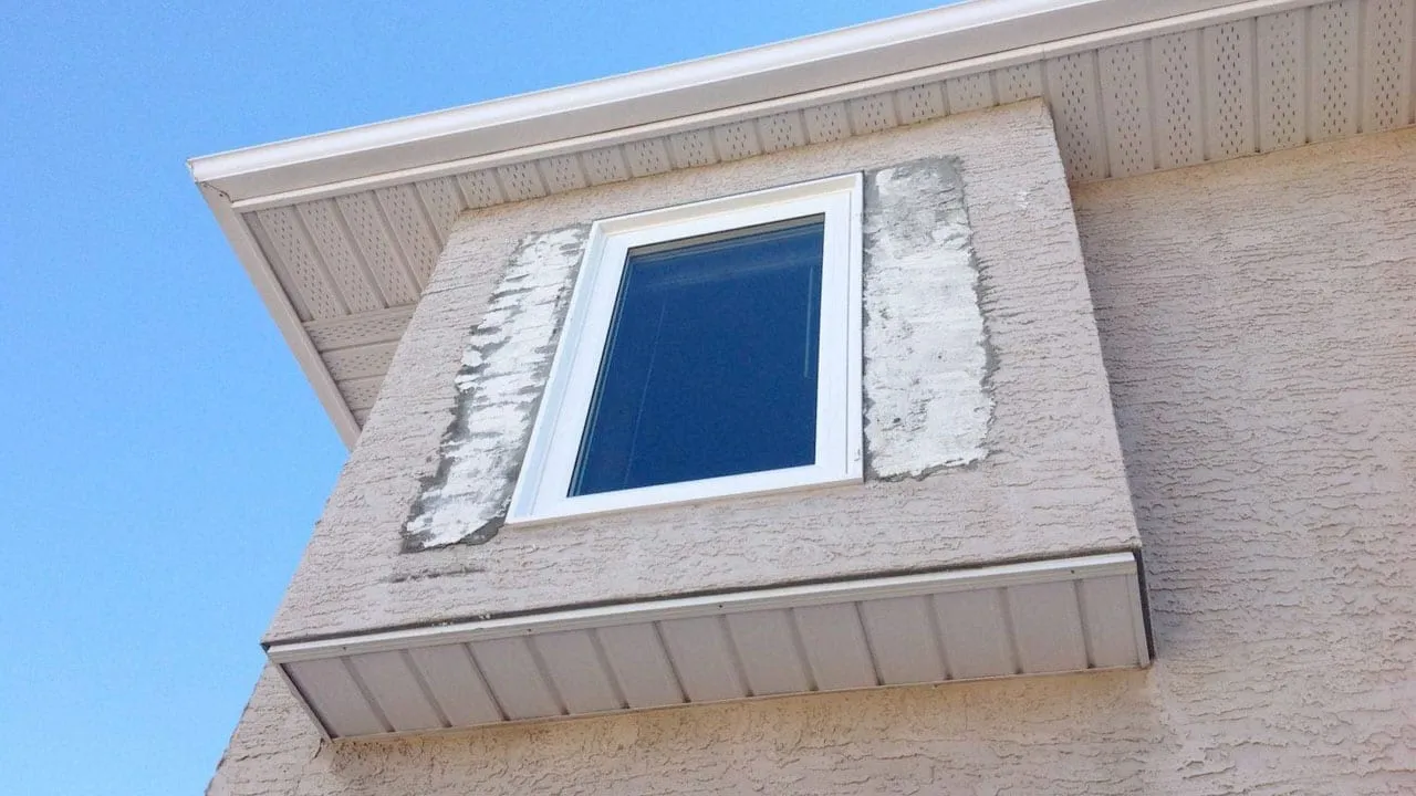 Replacement window installed in a stucco wall